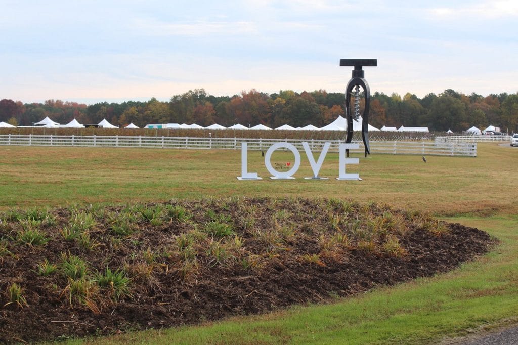 The "LOVE" sign and giant corkscrew at The Dog and Oyster Vineyard — a great place for fall getaways in Virginia