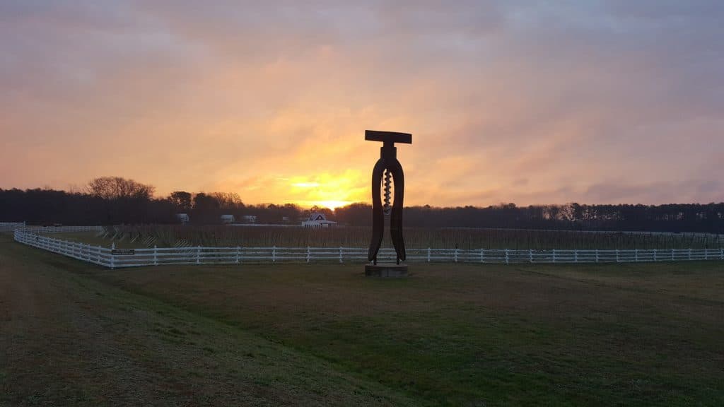 A giant corkscrew during sunset at The Dog and Oyster Vineyard, which is a destination for the Wine & Cherries Weekend