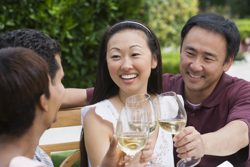 Diverse couples enjoying wine tasting in Irvington, Virginia, one of the most romantic places in Virginia